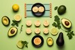  a plate of crackers, avocado, lemons, limes, and an avocado on a green background.