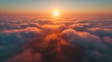 Breathtaking Aerial View Of A Sunrise Above The Clouds With Trees