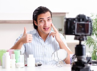 Wall Mural - Young handsome man recording his blog in hygiene concept