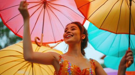 Aufkleber - A woman is seen holding a bunch of colorful umbrellas. This versatile image can be used to depict protection from rain or as a symbol of diversity and individuality