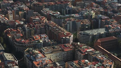 Wall Mural - Aerial view of Barcelona City Skyline and Sagrada Familia Cathedral at sunset. Residential famous urban grid of Catalonia. Beautiful panorama of Barcelona.