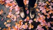 Woman's boots on sakura pink and orange petals, rain, spring photography	
