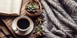 minimalistic design Top view of cosy home scene. Books, woolen blanket, cup of coffee and succulent plants over wooden background. Copy space