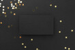 © New Africa - Blank business card and confetti on black background, top view. Mockup for design