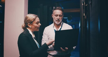 Canvas Print - Server room, man and woman or laptop with discussion, information technology and online workplace. Datacenter, people and collaboration with database to power computer hardware system and software