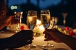 © SEUNGJIN - Romantic candlelight dinner for couple table setup at night. Man & Woman hold glass of Champaign. Concept for valentine's day or date. generative ai.
