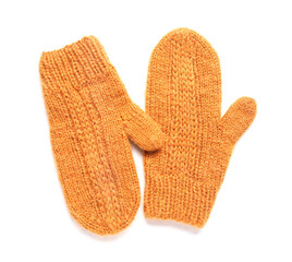 Sticker - Pair of orange warm knitted mittens on white background