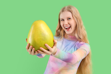 Canvas Print - Young woman with pomelo on green background