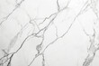 White marble background with distinctive dark grey veins creating a luxurious and natural pattern.