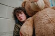 A goofy young man struggling to pull out an oversized teddy bear, stumbling over himself.