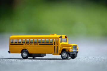 Sticker - Model of classical american yellow school bus for transporting of kids to and from school every day. Concept of education in the USA