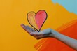 Self-Care Symbolized: Hand Holding Colorful Heart

