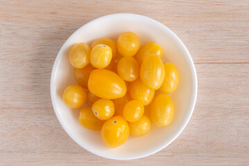 Wall Mural - Yellow Grape Tomatoes in a Bowl