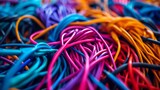 Fototapeta  - A chaotic jumble of colorful cables creates a vibrant abstract pattern.