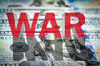  War text on the dollars banknotes background. The concept of war costs, military spending, molitary budget.