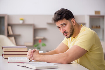 Sticker - Young male student studying at home