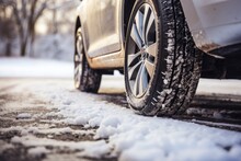 Winter tires gripping the road's surface for enhanced traction