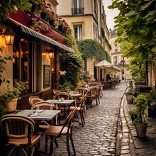 Street Cafe In The City.  The Streets Of Paris Are As Charming As Can Be. Cobblestone Streets, Tucked Away Plazas And Family-owned Cafes And Restaurants Are The Norm Here. 