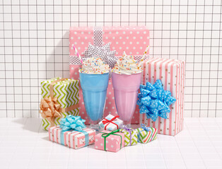 Theme of birthday celebration. Bright emotions with colorful creative gifts and milkshakes.