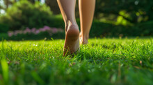 Close Up Of The Bare Feet Of A Person Walking On The Grass, Therapy And Reduce Stress In Living And Investing And Doing Business