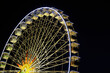 Night photo of a big wheel at a funfair in Nice, France