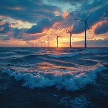 An Offshore Wind Farm With Turbines In The Ocean, Gentle Waves At The Bases And A Serene Sunset Background. Generative AI.