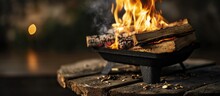Freshly Lit Barbecue Fire With Logs Of Burning Wood Over Small Chips Of Kindling In A Portable BBQ. Creative Banner. Copyspace Image