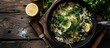 close up of Spanakorizo Greek spinach and rice pilaf with lemon dill scallion in frying pan on dark wooden table horizontal view from above. Creative Banner. Copyspace image