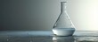 Close up view of transparent glass test flask with white liquid inside Isolated on grey backdrop Laboratory tests and research Chemistry science or medical biology experiment Laboratory backgro
