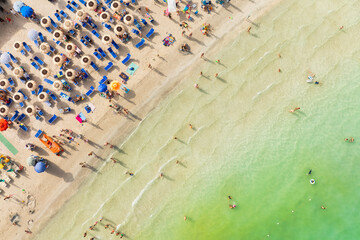 Wall Mural - aerial view on beach, people and umbrellas. vacation and adventure. europe, mediterranean sea. top v
