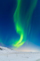 Wall Mural - Aurora Borealis. Northern Lights over the mountains. Scandinavia. Winter night landscape with bright lights in the sky. Landscape in the north in winter time.