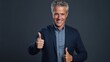 Handsome mature man showing thumbs up gesture on grey background. Generative AI