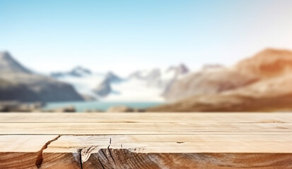 Blurred nature background with mountains lake valleys blue sky sunny day with empty plank wood table in the forefront for product placement presentation