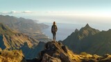 Fototapeta  - Beautiful tuorist woman stay on point of the island Madeira. View from Pico Ruivo in Madeira the highest in Portugal.