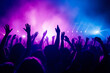 © AspctStyle - Energetic Crowd at a live concert with hands raised and colorful vibrant stage lights, music festival excitement concept