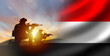 Soldiers with Yemen flag. Silhouettes of fighters at sunset. Yemen army. Military anti-terrorist operation concept. Soldiers state army. Yemen armed forces. Defense and anti-invasion forces. 3d image