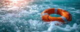 Fototapeta  - Summer safety at sea with blue water rescue ring floating buoy in ocean for emergency life saving protection security assistance from lifeguard round lifesaver saver against danger survival guard