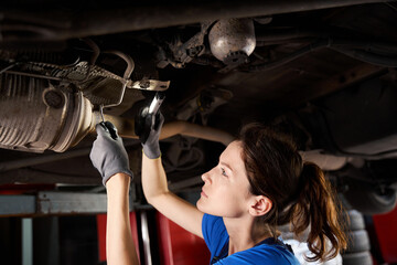 Wall Mural - Car is lifted on lift in car repair shop