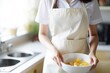 white apron mockup. a woman wearing a plain apron to cook