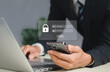 © Ei - Cybersecurity and privacy concepts to protect data. Lock icon and internet network security technology. Businessmen protecting personal data on laptop and virtual interfaces..