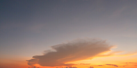 Wall Mural - Sunset sky. Abstract nature background. Dramatic blue with orange colorful clouds in twilight time.