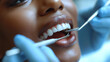 Dental examination with dental equipments. Young black girl with white teeth. Tooth care concept. Selective focus.