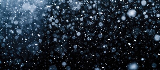 Poster - snowstorm stock image with falling snow on black background.