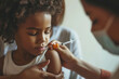 close-up of a child receiving a vaccination with a calm and reassuring healthcare professional, emphasizing the importance of a positive and supportive environment in a minimalisti