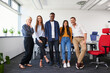 © baranq - Group of diverse team of colleagues at office standing together