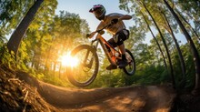 Mountain biker in mid-air on a forest trail captured with GoPro Hero 9 wide angle
