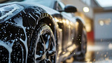 Professional Car Wash black Sportscar with Shampoo close-up