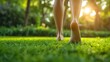A close-up view of a woman strolling barefoot across verdant lawn with sun rays, space, Generative AI.