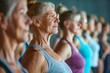 © Nuttakarn - Radiant Senior Lady Enjoying Group Yoga Practice