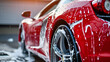© john - Professional Car Wash Red Sportscar with Shampoo close-up